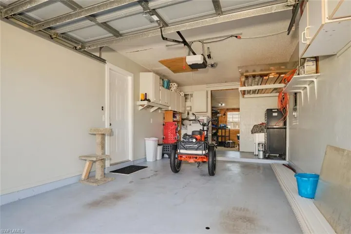 Garage featuring a garage door opener