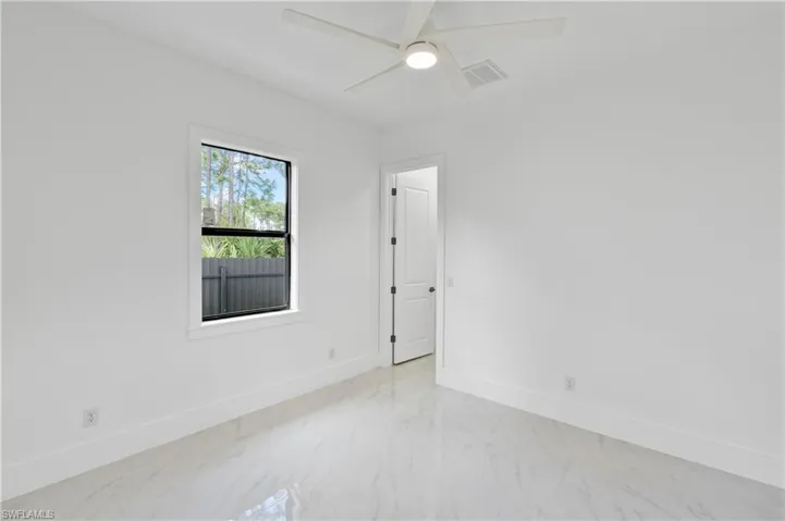 Unfurnished room with ceiling fan
