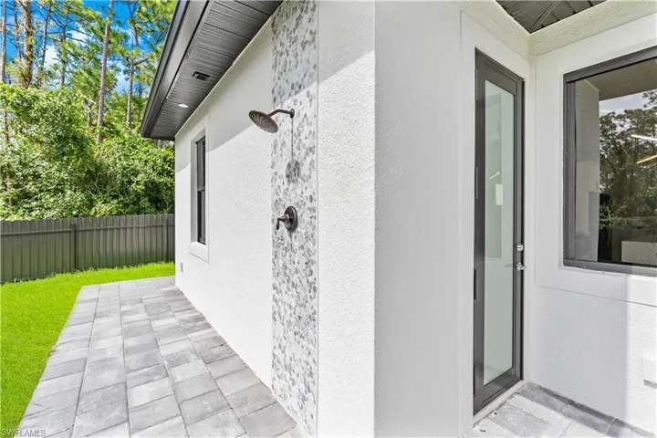 Doorway to property featuring a patio