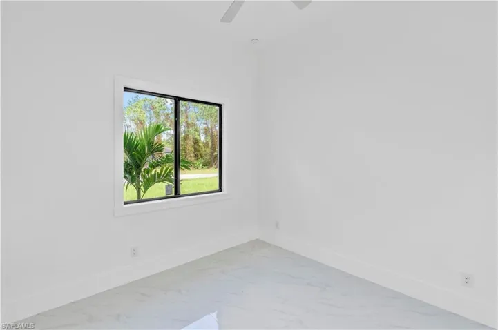Spare room with ceiling fan