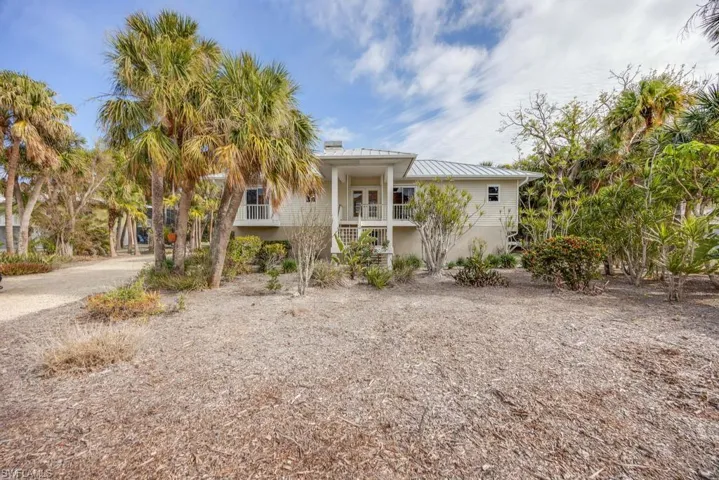 Beach home featuring a porch