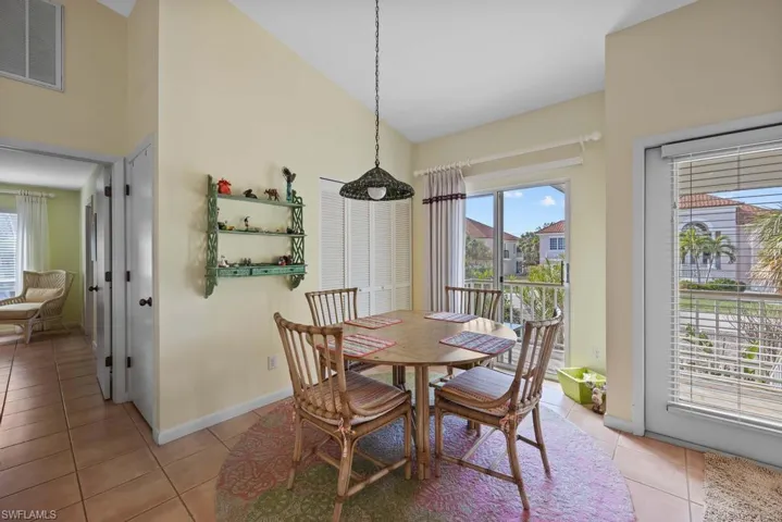 Dining area featuring light tile patterned floors
