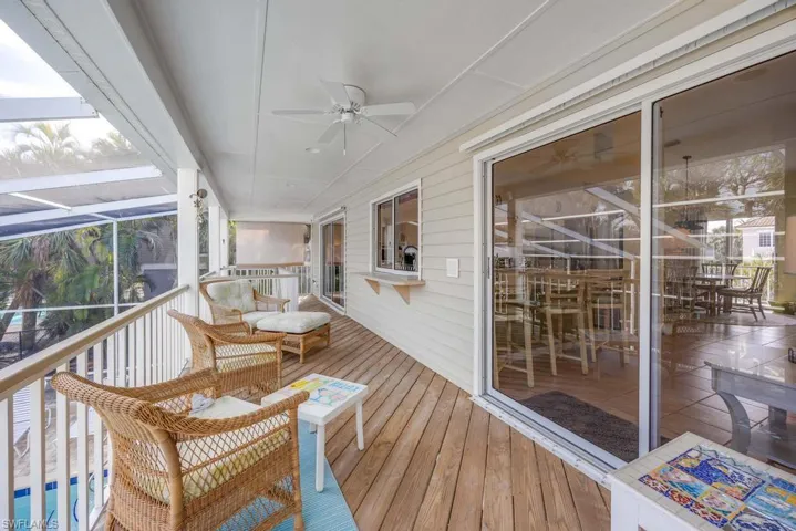 Deck with ceiling fan and a pool