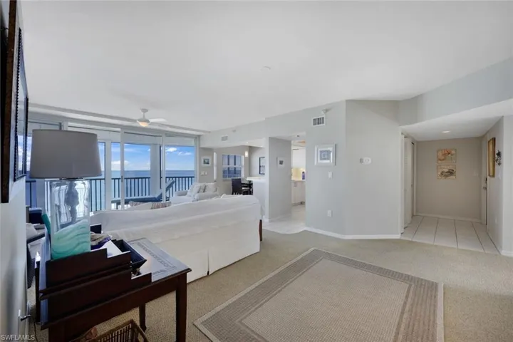 View of foyer, kitchen, living area.