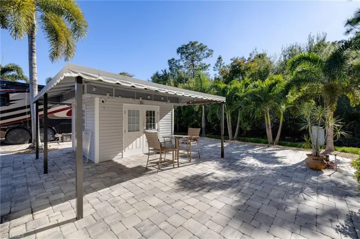 View of patio with an outbuilding