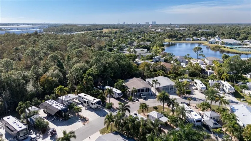 Aerial overview of property's location with a nearby body of water and nearby suburban area