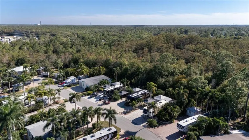 Aerial view of residential area with a heavily wooded area