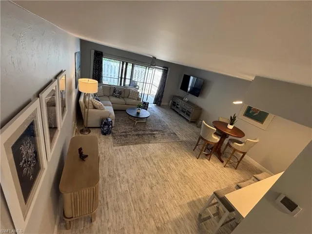 Living room with baseboards and wood finished floors