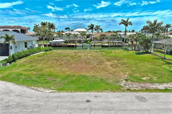 View of yard featuring a residential view and a water view