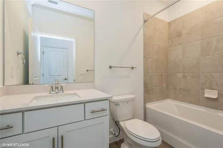 Full bathroom with vanity and bathtub / shower combination