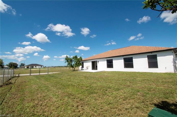 Rear Elevation with fenced in yard!  Plenty of room for a pool.