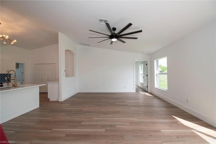 Great Room Facing Primary Bedroom Entry and Dining area