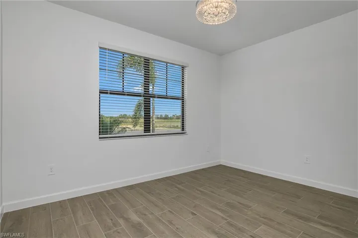 Guest Bedroom #3 at the front of the home can be used as a bedroom or office.