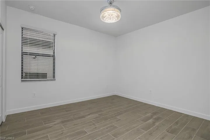 Guest bedroom #2 includes chandelier/fan and a dedicated bath.