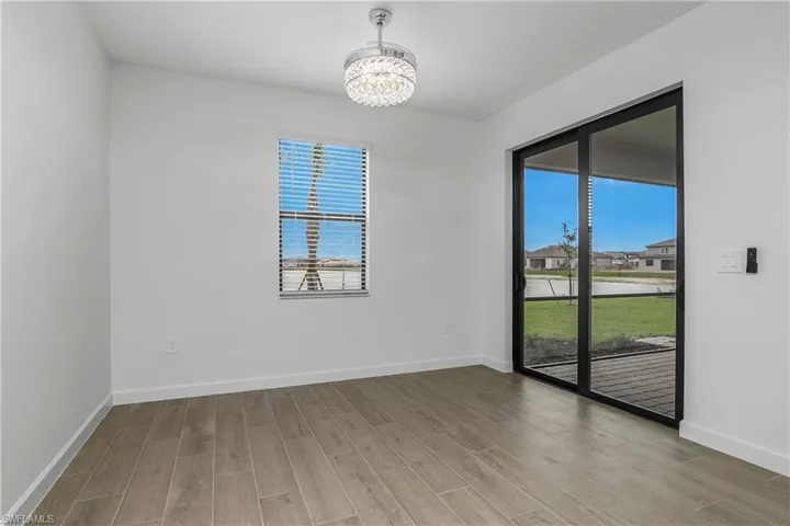 Kitchen Cafe/Dining area is just off the kitchen and has it's own sliders to the screened in lanai.