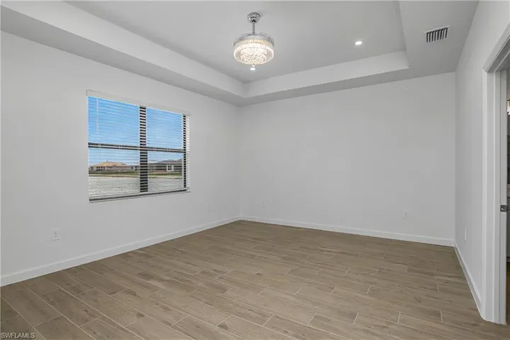 Owner Bedroom is spacious with tray ceilings and beautiful long lake views!