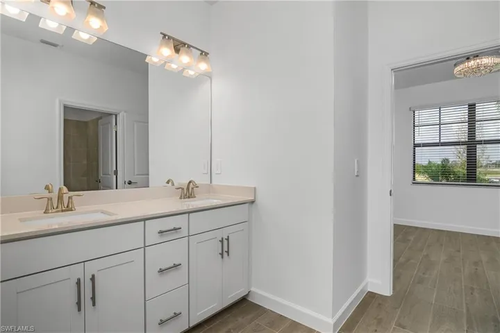 Jack and Jill bath connects Bedrooms 3 and 4, featuring convenient walk through space with dual sinks and oversized vanity.