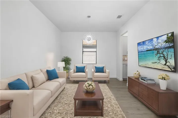 This versatile space can be used as a large den/office, or as a formal dining area. (shown here as den, furnishings digitally added)