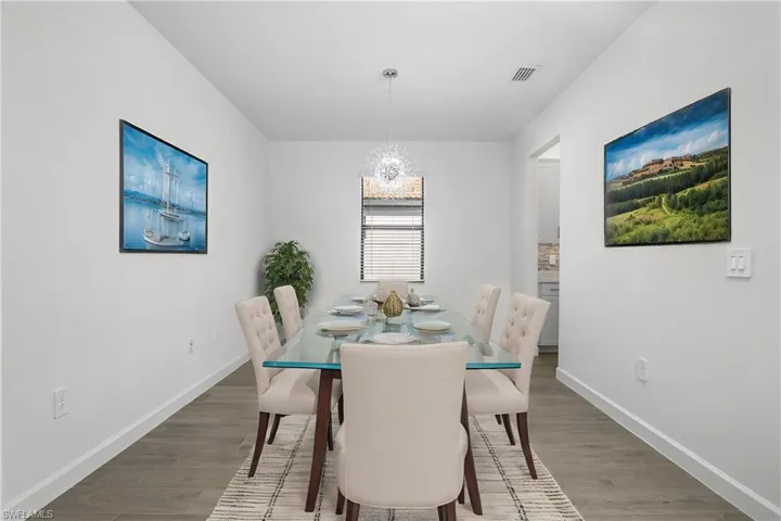 This versatile space can be used as a large den/office, or as a formal dining area. (shown here as dining area furnishings digitally added)