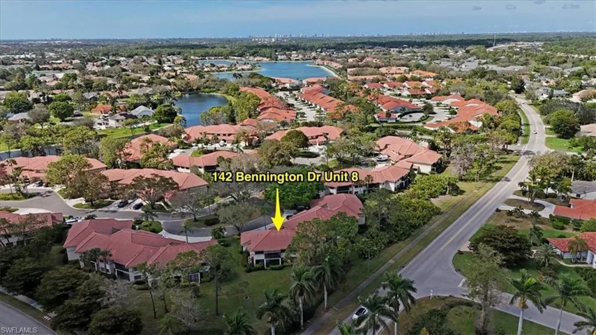 Birds eye view of property featuring a water view and a residential view