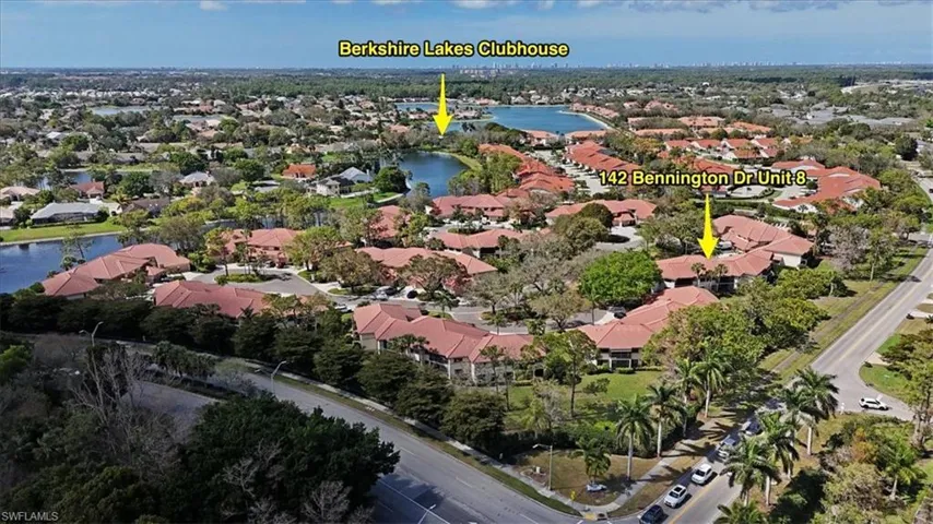 Aerial view featuring a water view and a residential view