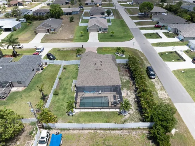 Aerial view of property's location featuring nearby suburban area
