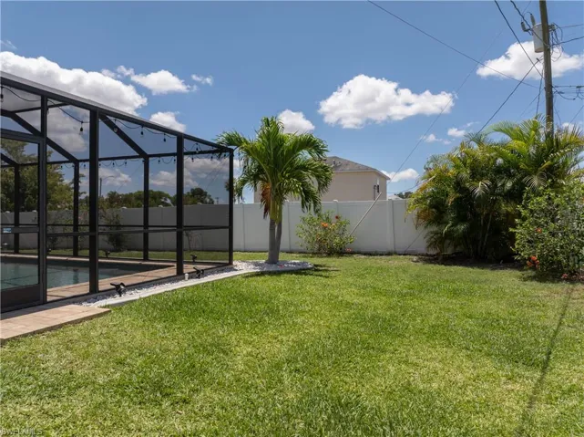 View of yard with a lanai
