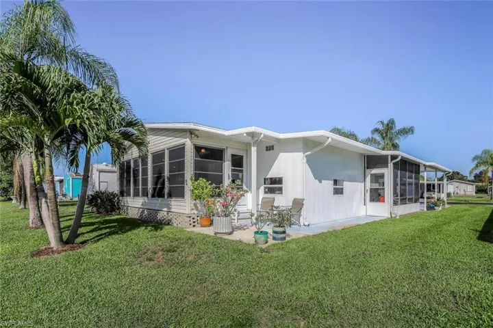 10591 Wales Loop Bonita Springs.  Manufactured home located in a 55+ Co Op community.