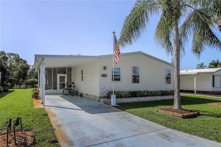 10591 Wales Loop Bonita Springs.  Manufactured home located in a 55+ Co Op community.