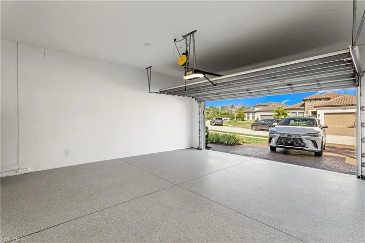 Garage featuring a garage door opener