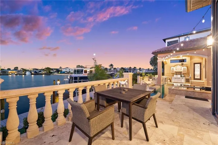 Patio terrace at dusk with a water view