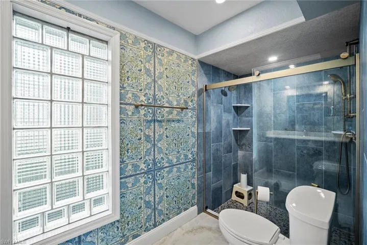 Bathroom with toilet and walk in shower