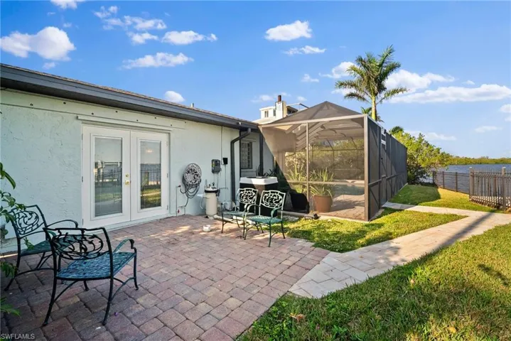 View of patio featuring a lanai and french doors