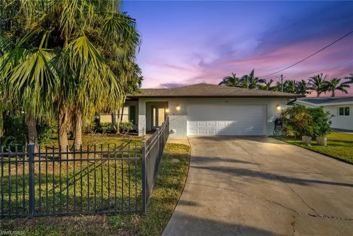 View of front of home featuring a garage