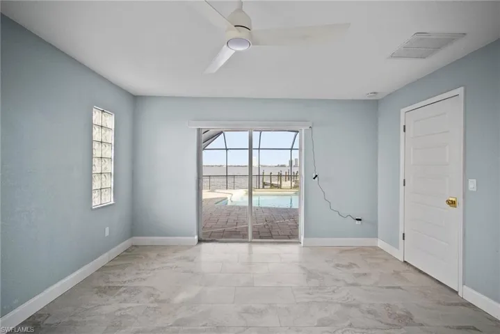 Empty room featuring ceiling fan