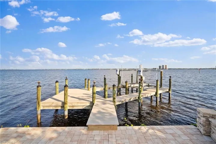 Dock area featuring a water view