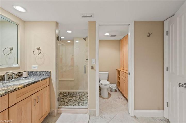 Master shower stall and water closet , loads of storage