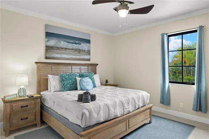 2nd Master Bedroom featuring ceiling fan and crown molding