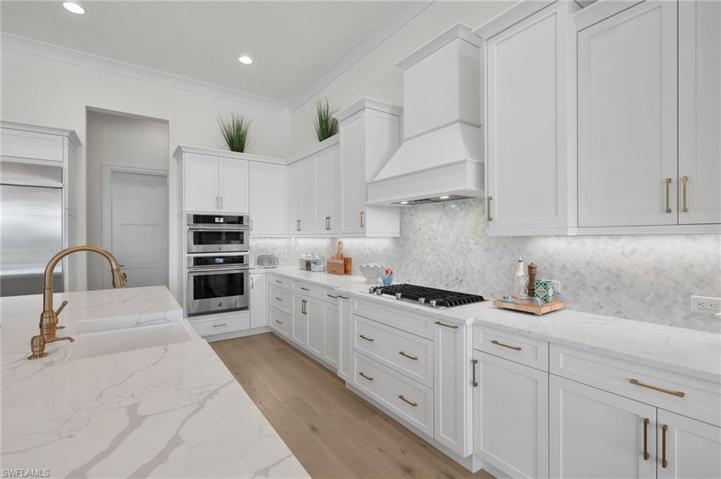 Loads of Counter and Storage Space. Note the Work put into the Tile Backsplash.