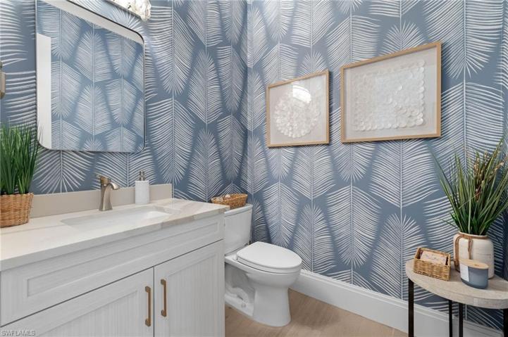 Half Bath, Upgraded Single Faucet Fixture, and Rectangular Cut Sinks. Attractive Wall Coverings.