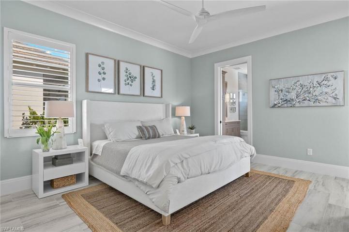 Guest Bedroom with Full Bath. Plantation Shutters, Crown Molding and High End Lighting and Fan.