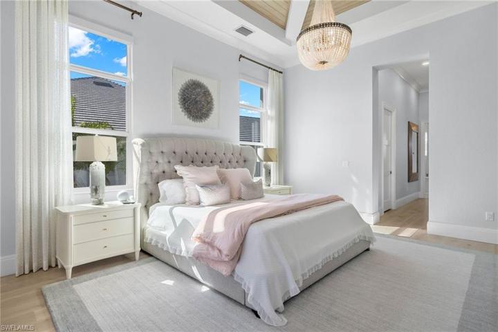 Opposite View of the Master Bedroom Looking to the Bath Entry, 2 Walk-in-Closets. Blonde Wood Flooring.