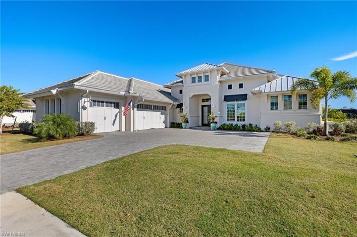 Lovely Curb Appeal, Accented by the Metal Roofing Sections, Large 3 Car Garage, Ample Parking.