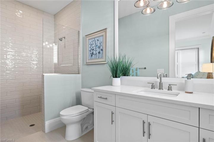 Ensuite Bathroom with Walk-in-Shower, Framed Mirrors, Rectangular Cut Sink.