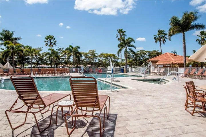 Community pool with a patio