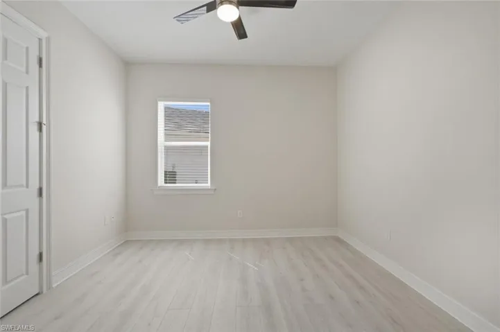 Unfurnished bedroom featuring light wood finished floors and ceiling fan