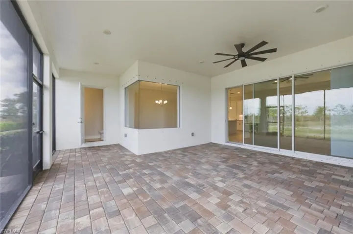 Unfurnished sunroom with a chandelier