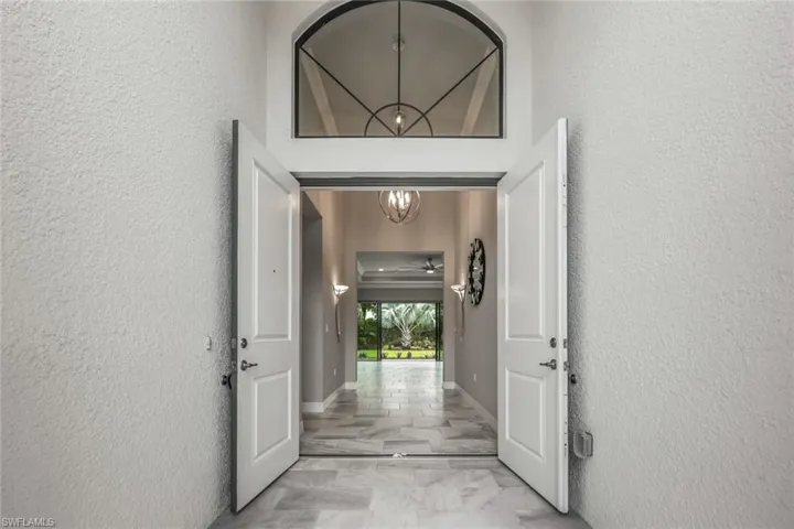 Stunning Tiled Entryway with French Doors