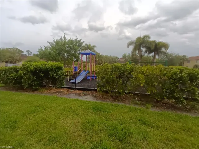 Community playground featuring a yard