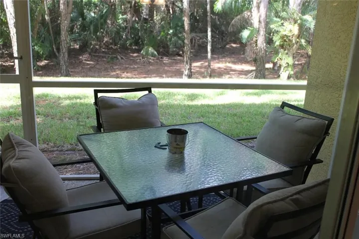 Sunroom featuring outdoor dining space